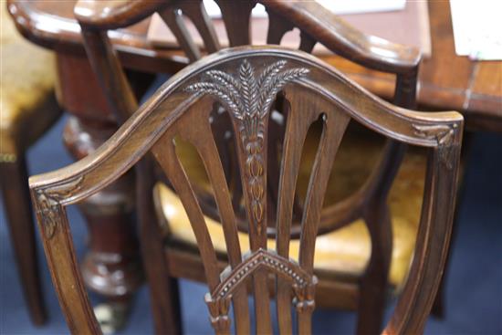 A set of twelve Hepplewhite style mahogany dining chairs